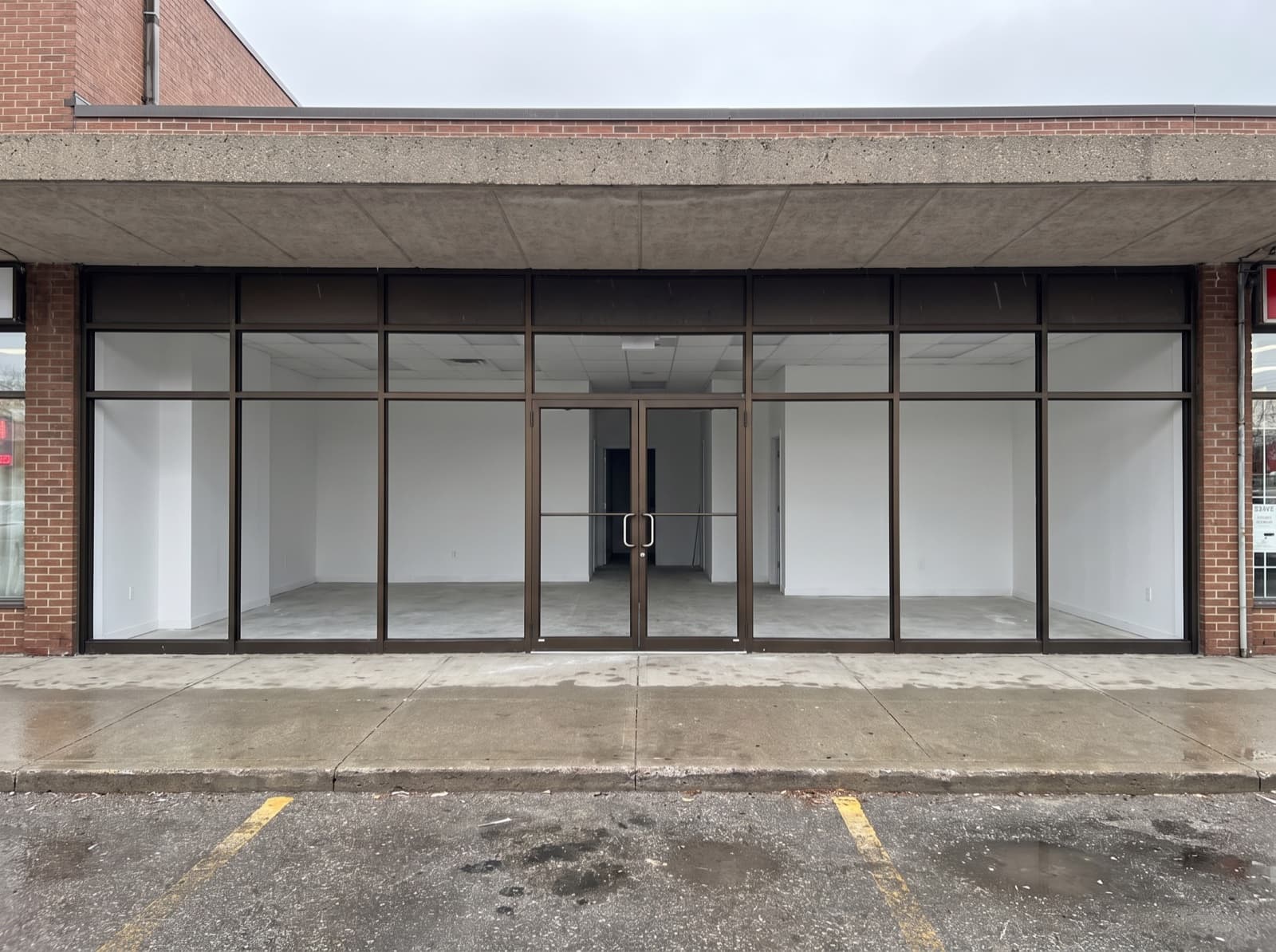 GTA retail plaza aluminum storefront double doors with commercial closers and tempered glass